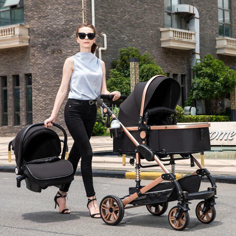 mom with black gold 3 in 1 luxury stroller and car seat